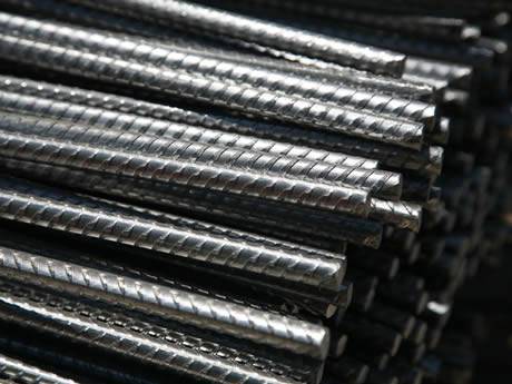 deformed stainless steel rebars lying on the wooden boards